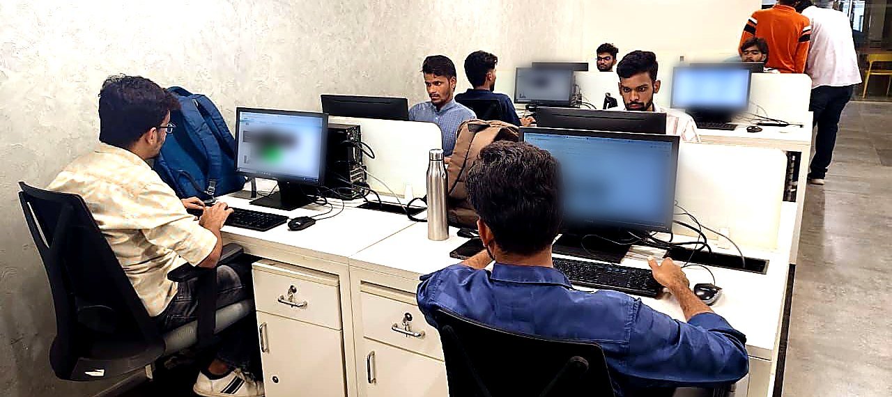 Accutech reviewers at workstations on the image review floor