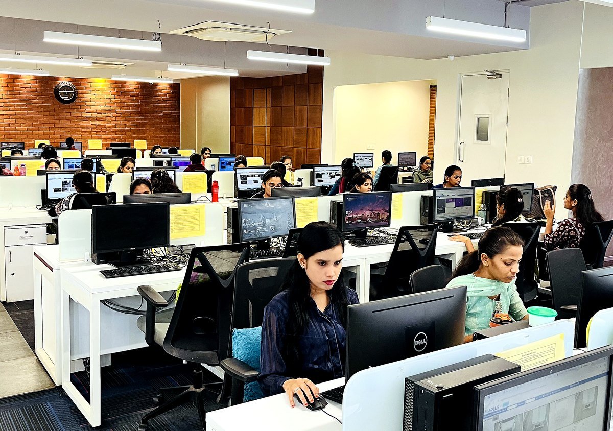 The Accutech review floor, reviewers at workstations