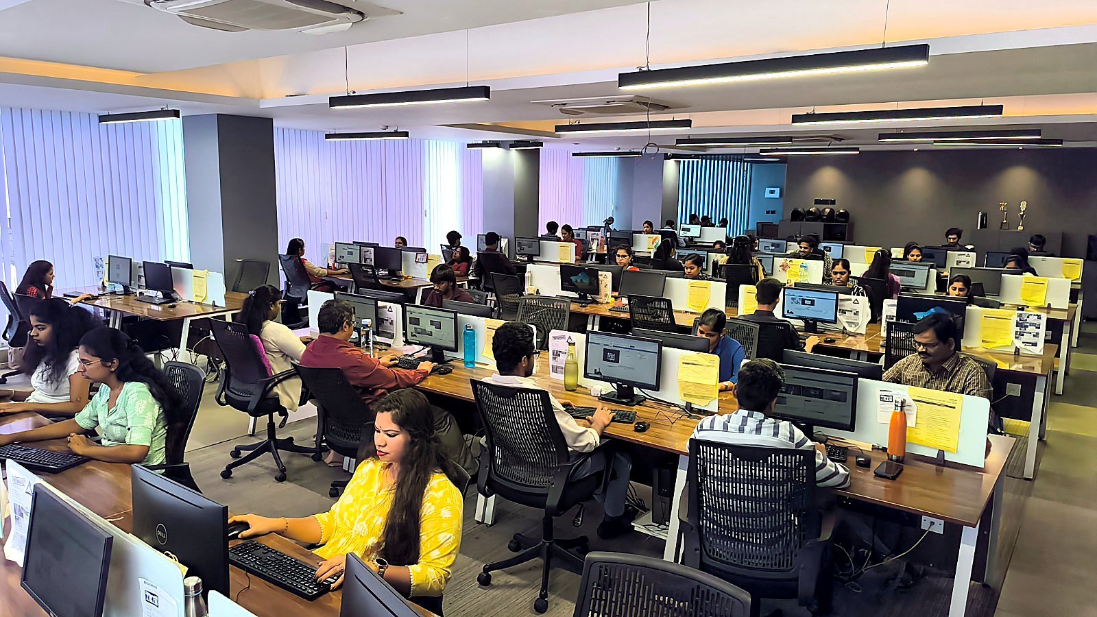 Accutech reviewers at workstations on the image review floor